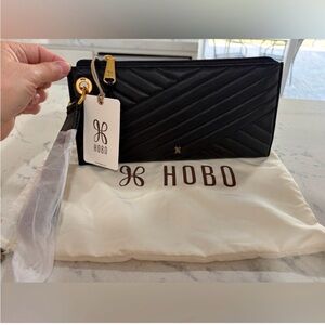 HOBO Black Leather Quilted Clutch with Gold Accents